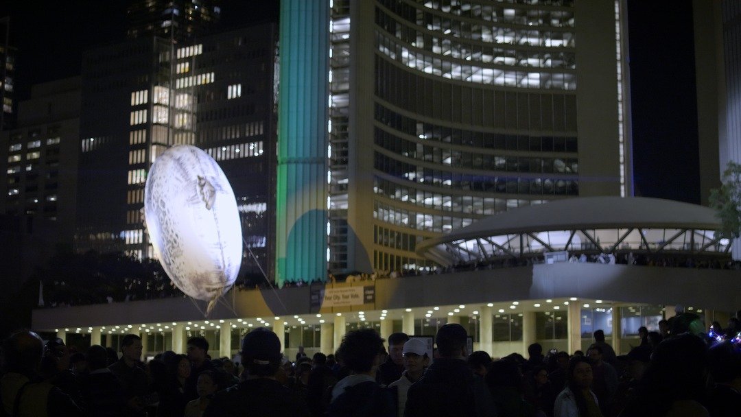 Illuminated moon installation at Nathan Phillips Square